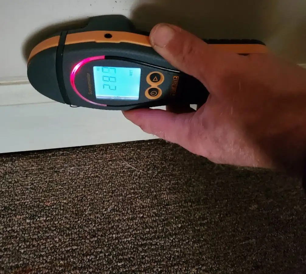 Moisture detection at baseboard during Storm Damage Restoration in Red Hill